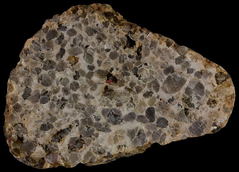 A fine-grained quartzose conglomerate with a dolomitic cement. The width of the sample is 5 cm.