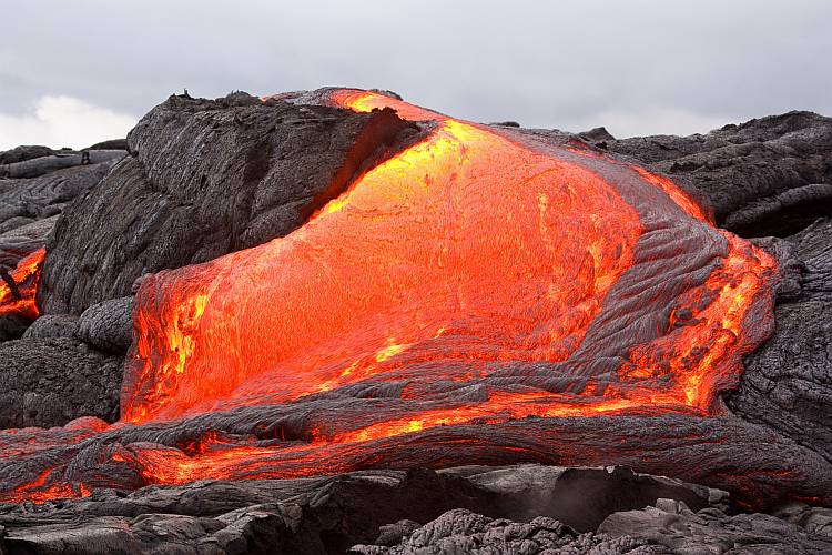 Glowing lava forming new land in Hawaii. Kilauea volcano, Pu'u O'o vent.