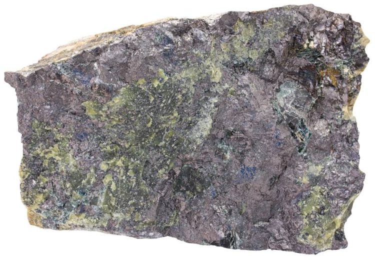 Magnetite in skarn with serpentine and talc. Width of sample: 11 cm.