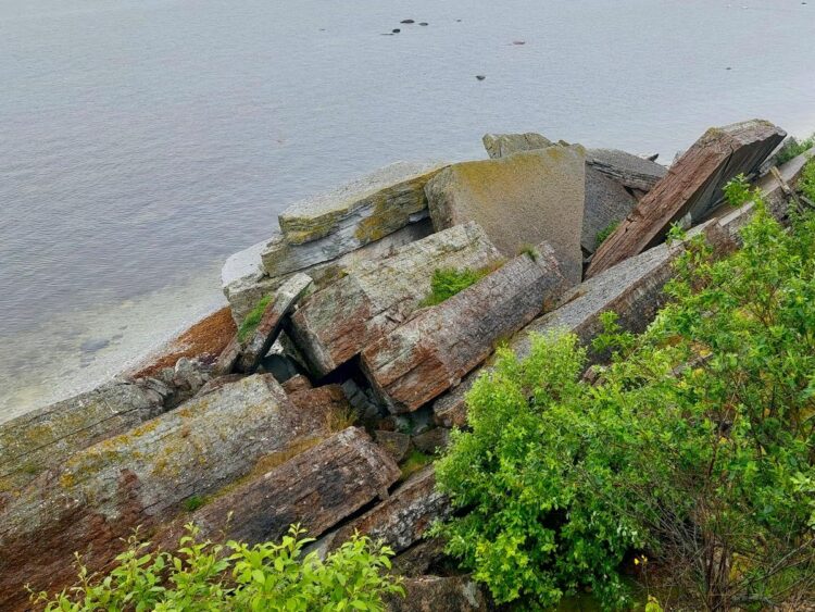 Large slabs of limestone broken off as the sea undercuts the cliff.