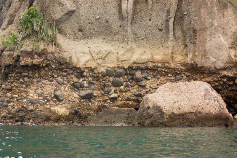 Coastal cliff of Saint Lucia composed of conglomerate and volcanoclastic rocks