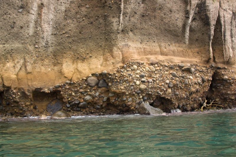 Coastal cliff of Saint Lucia composed of conglomerate and volcanoclastic rocks