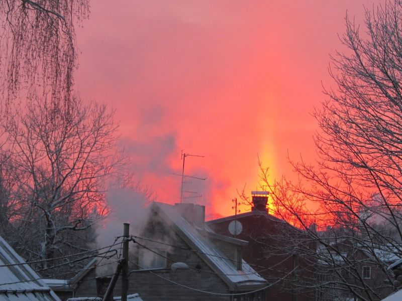 Sun pillar above rising Sun